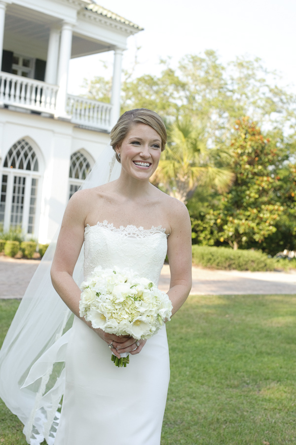 happy bride walking towards ceremony - wedding photo by top South Carolina wedding photographer Leigh Webber